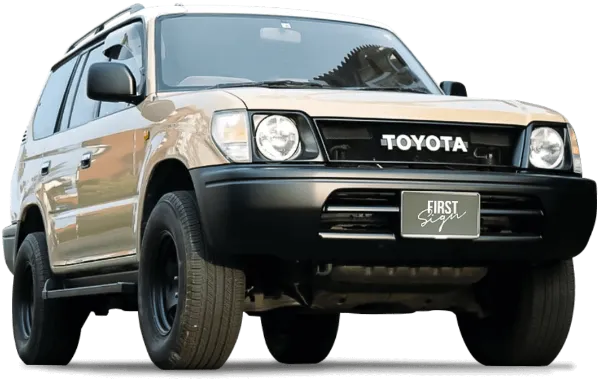 ベージュと黒のツートンカラーのトヨタSUVが道路上に停まっている様子